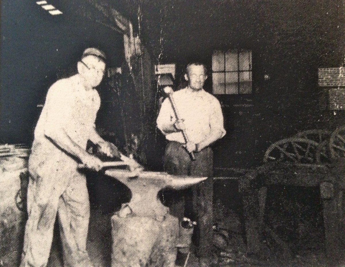 James Solomon HOLDER at anvil in blacksmith shop